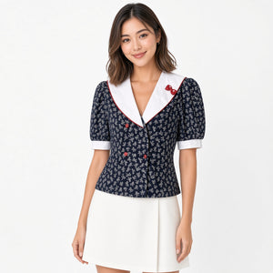 Vintage navy sailor blouse with white collar and bow print, front
Vintage navy sailor blouse sailor collar front view