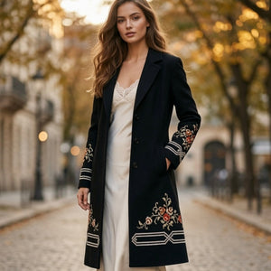 woman wearing vintage black embroidered coat with floral folk art, street view