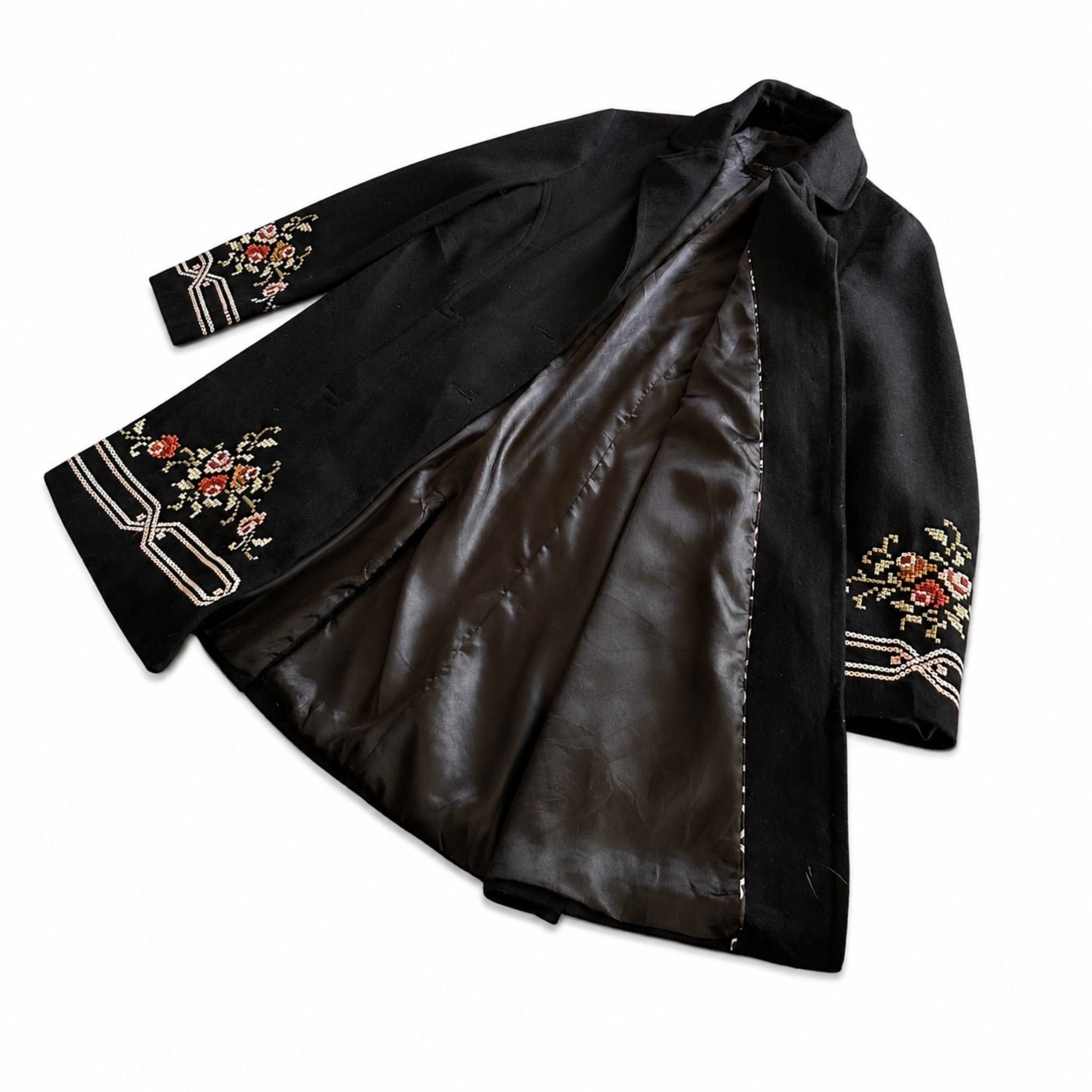 Vintage black embroidered coat with floral folk art, front view lining